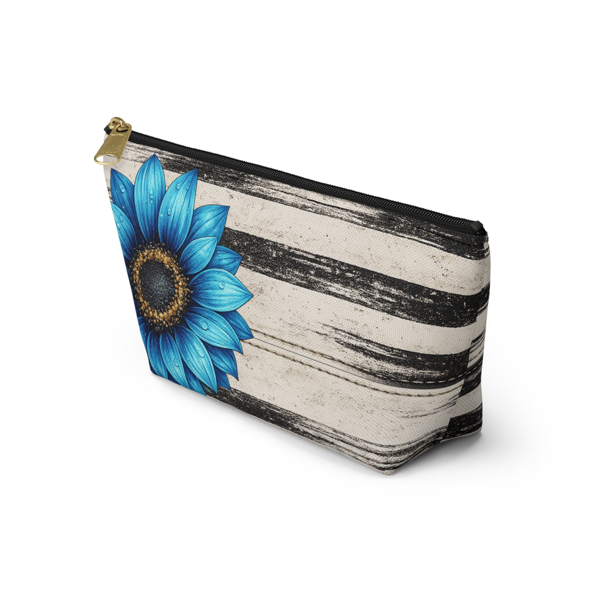 Angled product view of the Boho Sunflower Makeup Bag with black-and-beige vintage stripes, large blue sunflower artwork, gold zipper pull, and upright T-bottom shape.